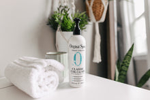 Load image into Gallery viewer, Bottle of Original Sprout Classic Curl Calmer on a bathroom counter with towels and plants in the background.