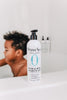 Bottle of Original Sprout hair and body wash with a child in the background