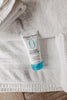 Tube of Original Sprout Classic Shampoo on a towel