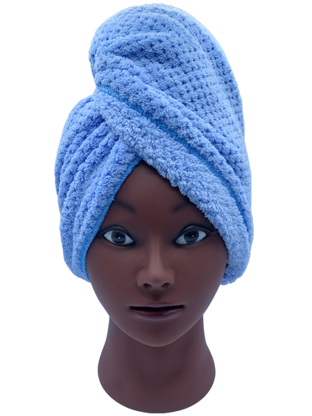 A mannequin head wearing a blue, absorbant hair towel