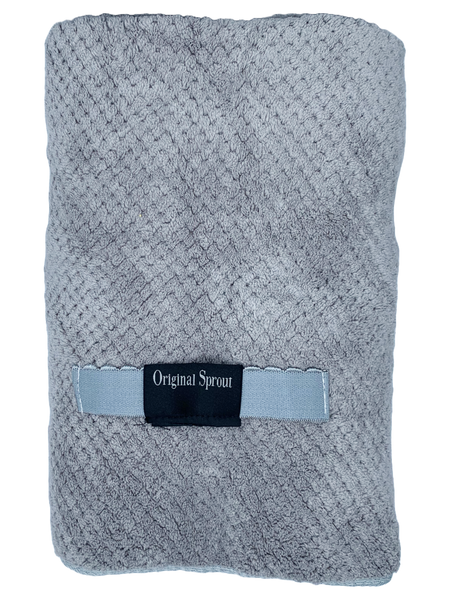 A gray, absorbent hair towel.